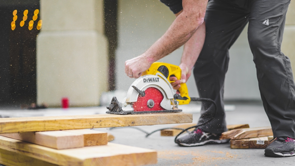 A construction worker using a skill saw